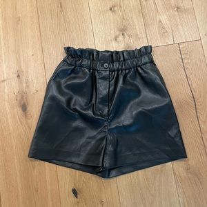 Black faux leather shorts